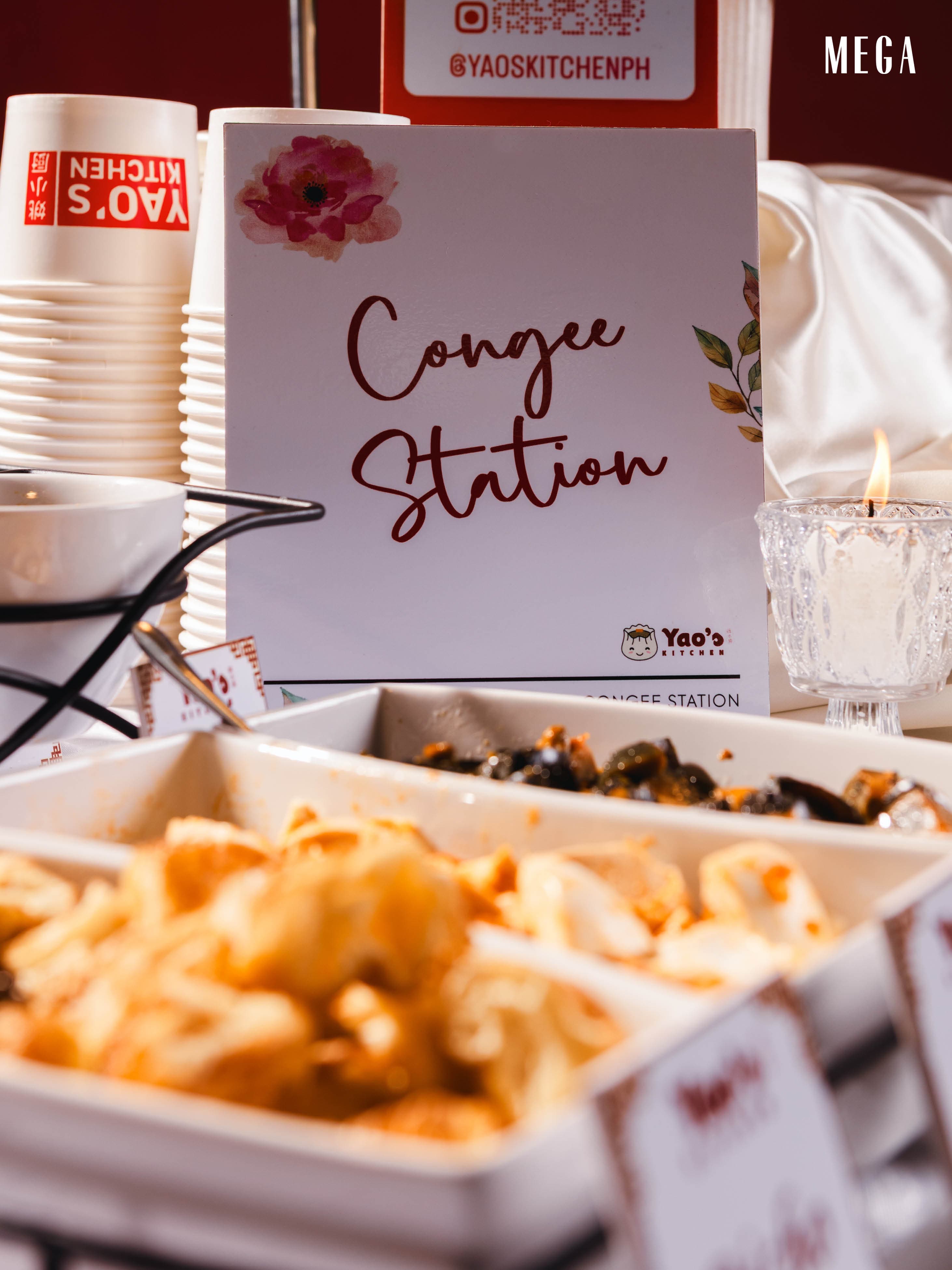 Congee Station sign with candlelight